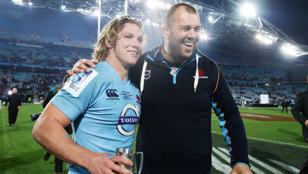 Michael Cheika and Michael Hooper celebrate victory over the Crusaders in the Super Rugby decider in 2014. Is Cheika the man to turn around the waratahs?