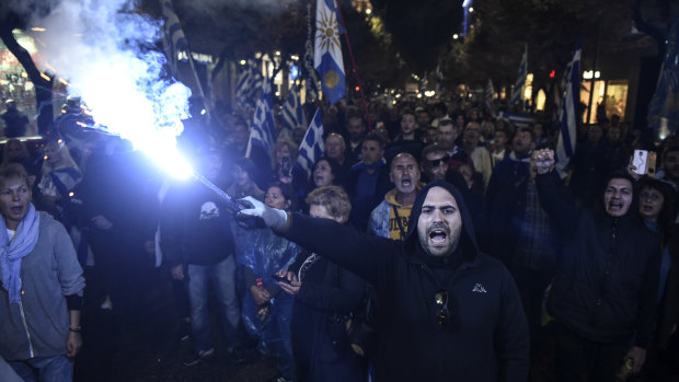 Greek protesters chant slogans against Greece's name deal with neighboring Macedonia, during a rally in the northern city of Thessaloniki, on Sunday.