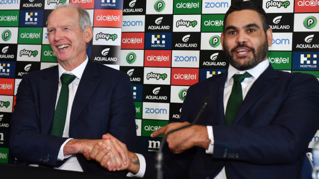 Take care: Greg Inglis enjoys a light moment with Wayne Bennett at the press conference to announce his retirement.