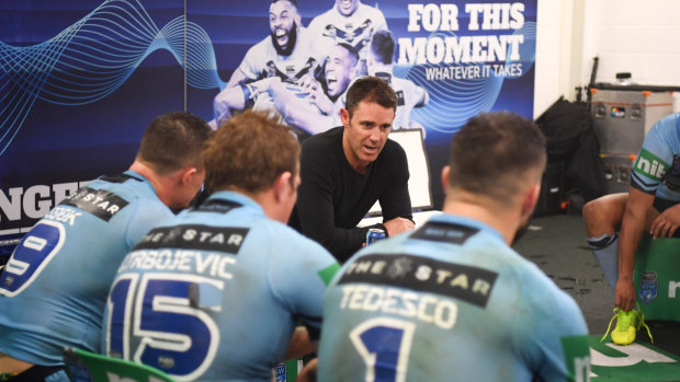 Feeling blue: Brad Fittler addresses his NSW side after their game III defeat.