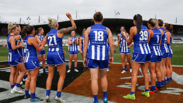 North Melbourne celebrate their close finals win over Collingwood. 