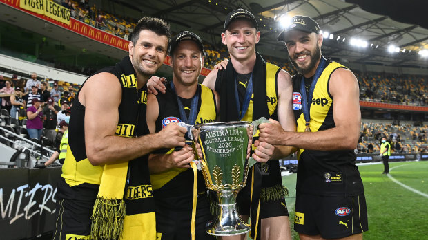 (L-R) Trent Cotchin, Kane Lambert, Dylan Grimes and Shane Edwards celebrate with the 2020 premiership cup. 
