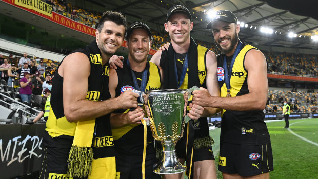 (L-R) Trent Cotchin, Kane Lambert, Dylan Grimes and Shane Edwards celebrate with the 2020 premiership cup. 