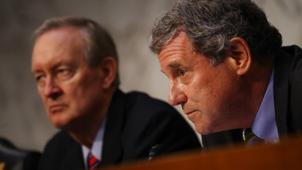 Senator Sherrod Brown of the Senate Banking Committee, right, and Senator Mike Crapo, chairman of the Senate Banking Committee, listen during a hearing about Facebook's cryptocurrency plan.