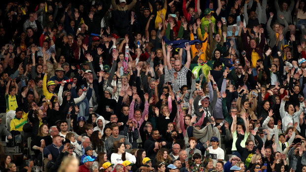 Record-breakers: Spectators in the crowd participate in a Mexican wave during the ICC Women's T20 Cricket World Cup Final match between India and Australia at the Melbourne Cricket Ground.