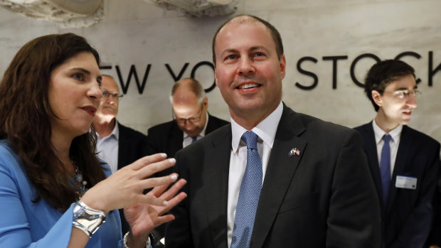  Josh Frydenberg talks with NYSE president Stacey Cunningham before ringing the opening bell.