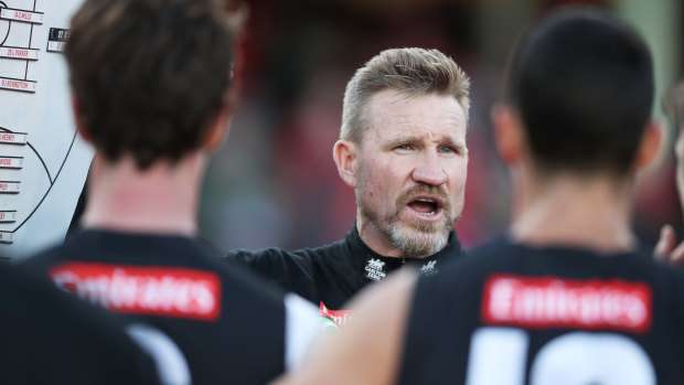 Nathan Buckley addresses a Collingwood huddle.