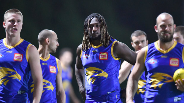 Nic Naitanui (centre) is seen during a West Coast Eagles training session at Metricon Stadium on the Gold Coast.