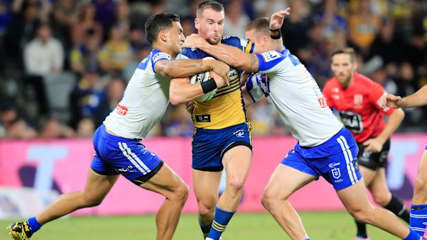 Parramatta captain Clint Gutherson takes on the Bulldogs defence in round one.
