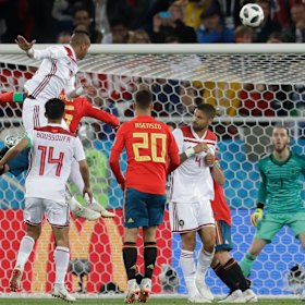 Morocco's Youssef En Nesyri rises to put Morocco ahead.