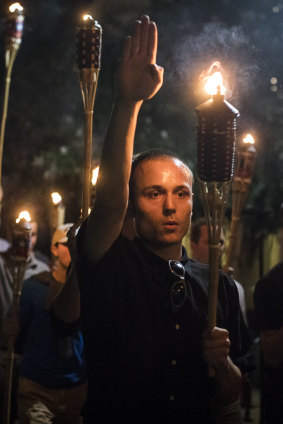 Torch-bearing white nationalists rally around a statue of Thomas Jefferson in Charlottesville in August 2017.