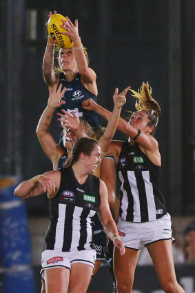 Bianca Jakobsson of the Blues takes a high mark during the AFL Women's 2017 round 1 match between Carlton Blues and Collingwood Magpies.