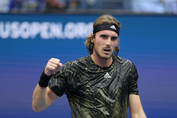 Stefanos Tsitsipas celebrates winning the fourth set against Andy Murray.