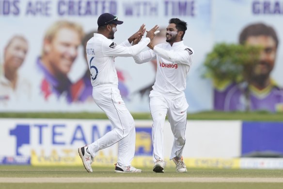 Sri Lanka’s Dhananjaya de Silva celebrates the wicket of Travis Head in the first Test.