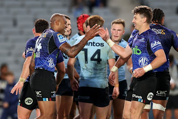 Mark Tele’a of the Blues celebrates with Beauden Barrett