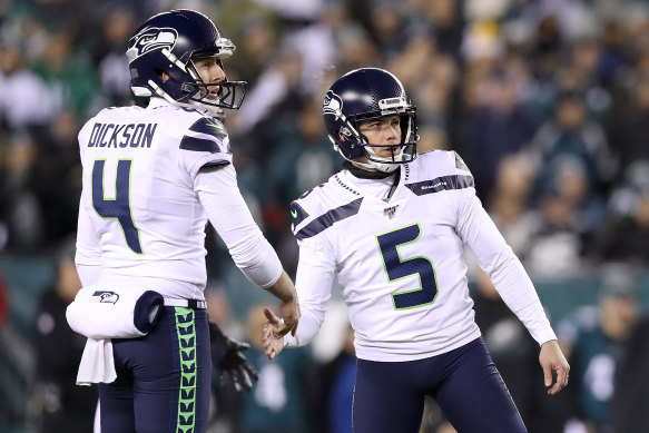 Seattle's Australian punter Michael Dickson celebrates a field goal with kicker Jason Myers.