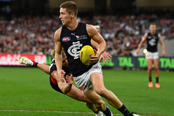 Lachie Fogarty avoids a Dyson Heppell tackle in Carlton’s win over the Dons.