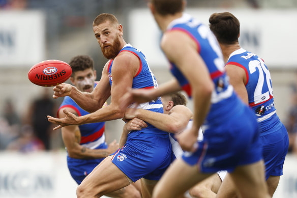 Liam Jones handballs for the  Bulldogs during the practice match against North Melbourne on the  weekend.