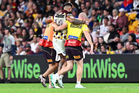 Broncos prop Payne Haas limps off.