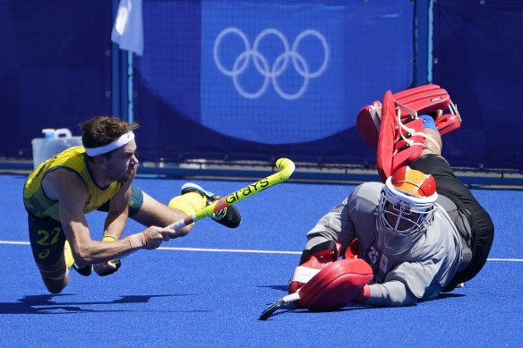 Flynn Ogilvie lands one of the penalties to help Australia to the semis in the men’s hockey competition. 