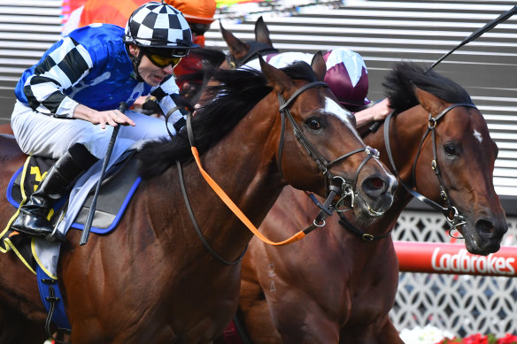 Jamie Spencer, left, rides Chief Ironside  to victory in the Crystal Mile at Moonee Valley. 