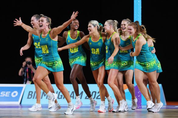 Australian players celebrate their netball gold medal win.