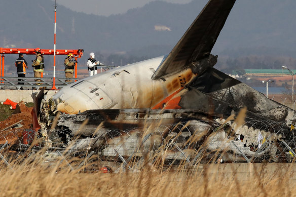 The wreckage of the crashed plane at Muan International Airport in South Korea on Sunday.
