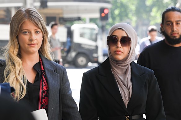 Former Bankstown nurse Sarah Abu Lebdeh (centre).