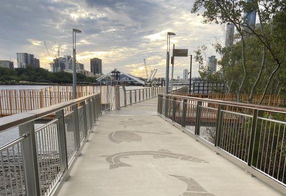 The Mangrove Walk along the Brisbane River. Totems from the Jagera and Turrbal people are included in the concrete walkway.
