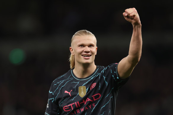 Haaland celebrates after scoring his penalty.