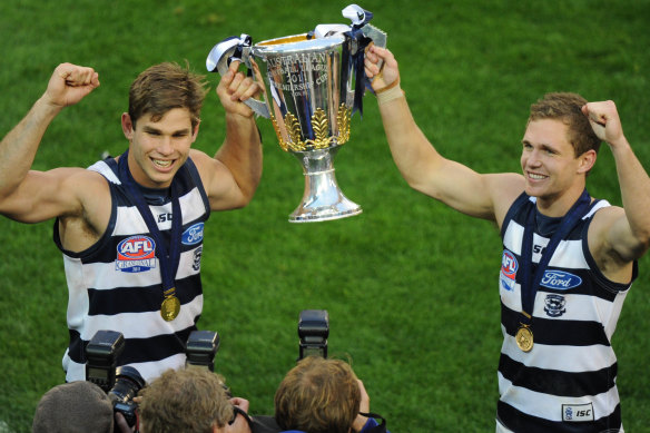 Tom Hawkins and Joel Selwood after the 2011 grand final.