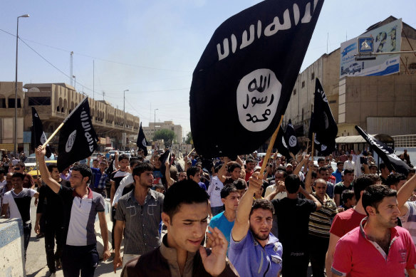 Islamic State supporters in Mosul in 2014. Their claim to Afghan territory puts the group in conflict with the Taliban.