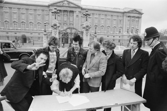 The Sex Pistols signing their record contract outside Buckingham Palace in 1978.