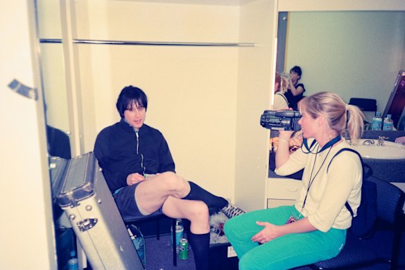 Tamra Davis, camera at hand, backstage at Summersault with Bikini Kill’s Billy Karren.