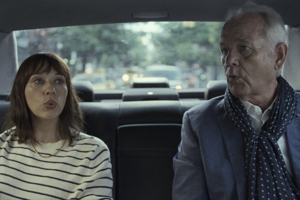 Laura (Rashida Jones) trying to whistle with her father Felix, (Bill Murray).