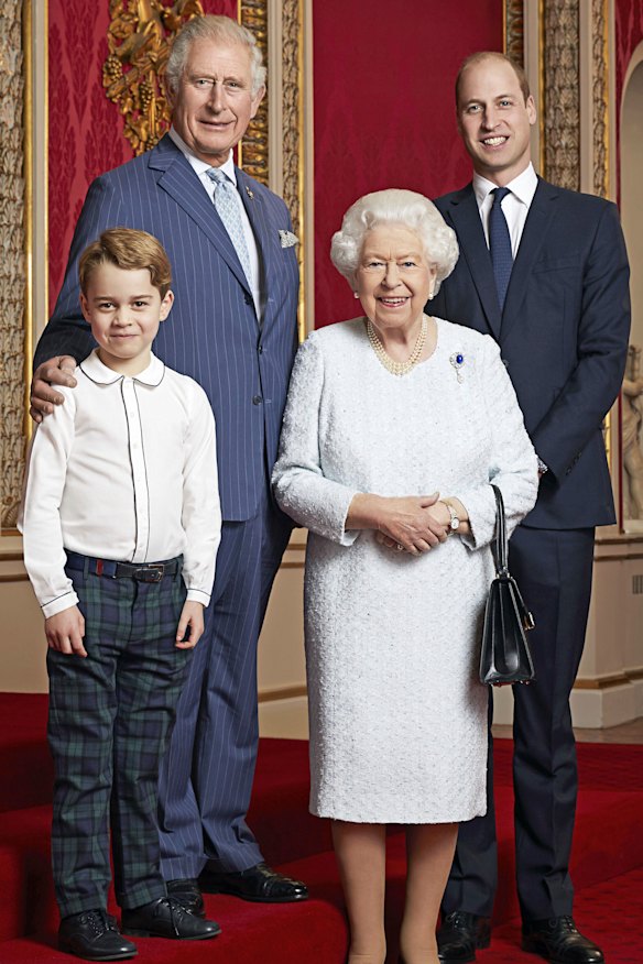 Queen Elizabeth, Prince Charles, Prince William and Prince George pose for a photo to mark the start of the new decade in the Throne Room of Buckingham Palace, London.