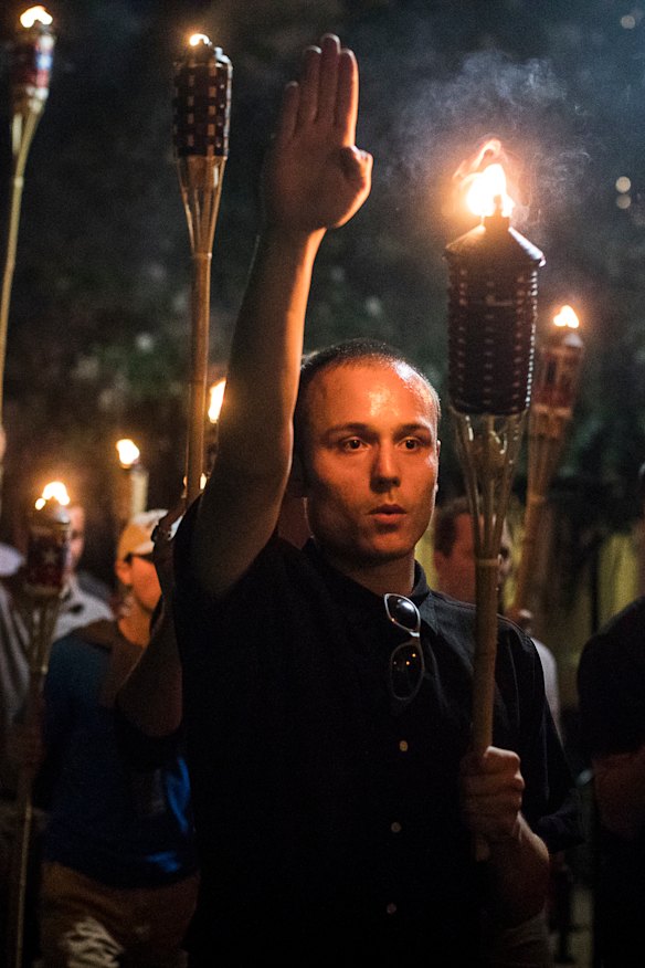 Torch-bearing white nationalists rally around a statue of Thomas Jefferson in Charlottesville in August 2017.