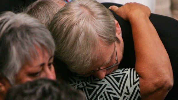 Kevin Rudd hugs guests after his apology to Indigenous Australians.