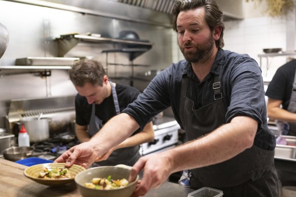 Chef and co-owner Mike Jaques (right) plating up in the Tulip kitchen.