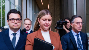 Brittany Higgins outside the Federal Court in Sydney last November, with partner David Sharaz, left, and lawyer Leon Zwier.