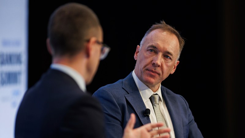 CBA retail boss' poorly timed Balinese holiday