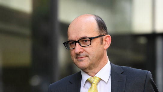 Victoria Police legal services director Fin McRae arrives at the royal commission on Friday. 