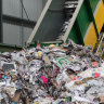 Coalition votes with Greens to ditch Morrison-era fee on rubbish shipped overseas