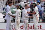 South Africa’s Marco Jansen shakes hands with Australia’s Nathan Lyon, and South Africa’s Simon Harmer shakes hands with Australia’s Josh Hazlewood.