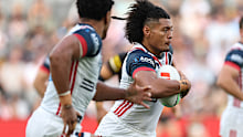 Naufahu Whyte of the Roosters runs the ball.