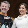 Denmark’s King Frederik X and Queen Mary wave from the balcony of Christiansborg Palace.