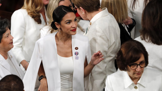 Democratic members of Congress, including Alexandria Ocasio-Cortez, centre, arrive before President Donald Trump delivers his State of the Union address.