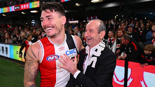 St Kilda president Andrew Bassat (right) embraces Josh Battle following the Saints’ win over the Swans.