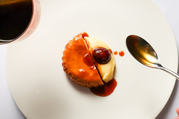 Quail pie wrapped in suet pastry with roasted cherries and Madeira sauce.