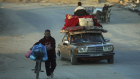 Palestinians flee the Israeli ground offensive in Khan Younis, Gaza Strip. 